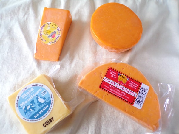 Cheddar vs Colby: Contrasting Cheese Flavors